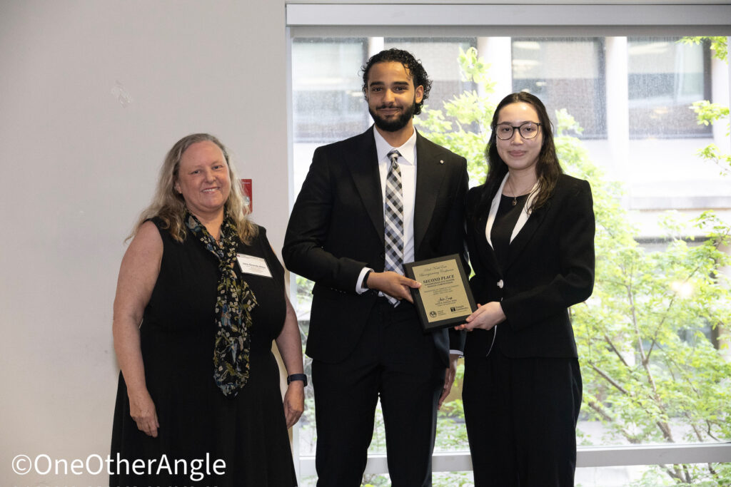 Jasmine and Hisham received the award on the stage.