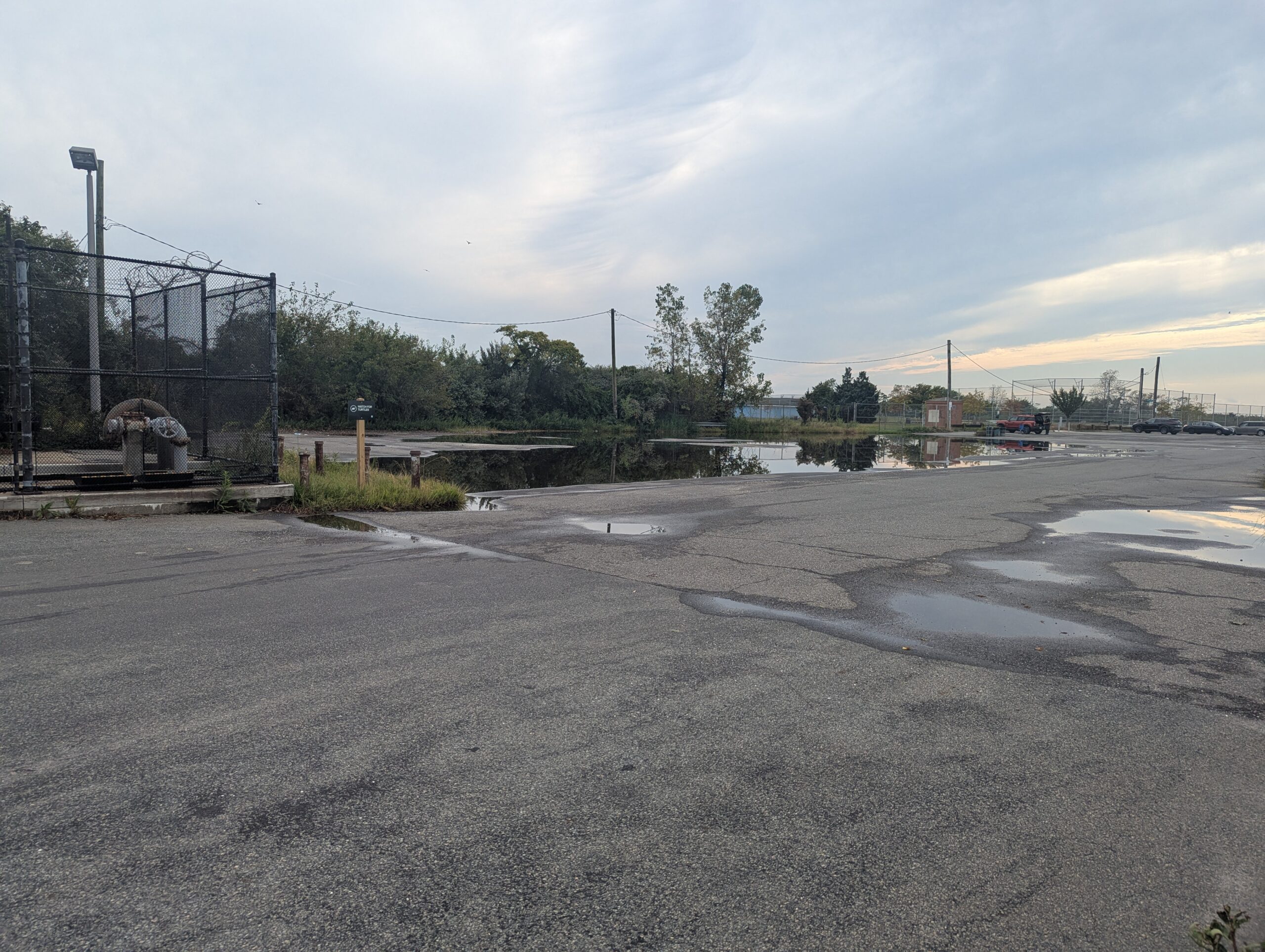 This is an image of the parking lot on site, which was taken after a rain event during a site visit on September 7th. Major flooding is depicted, covering nearly half of the lot.